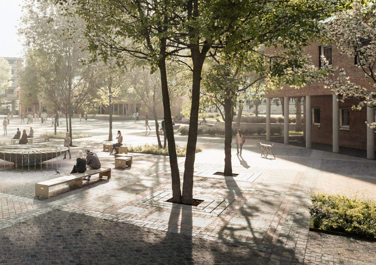 Der Kirchplatz des Michel nach der Umgestaltung. Zu sehen sind Sitzbänke, Bäume und der Brunnen.