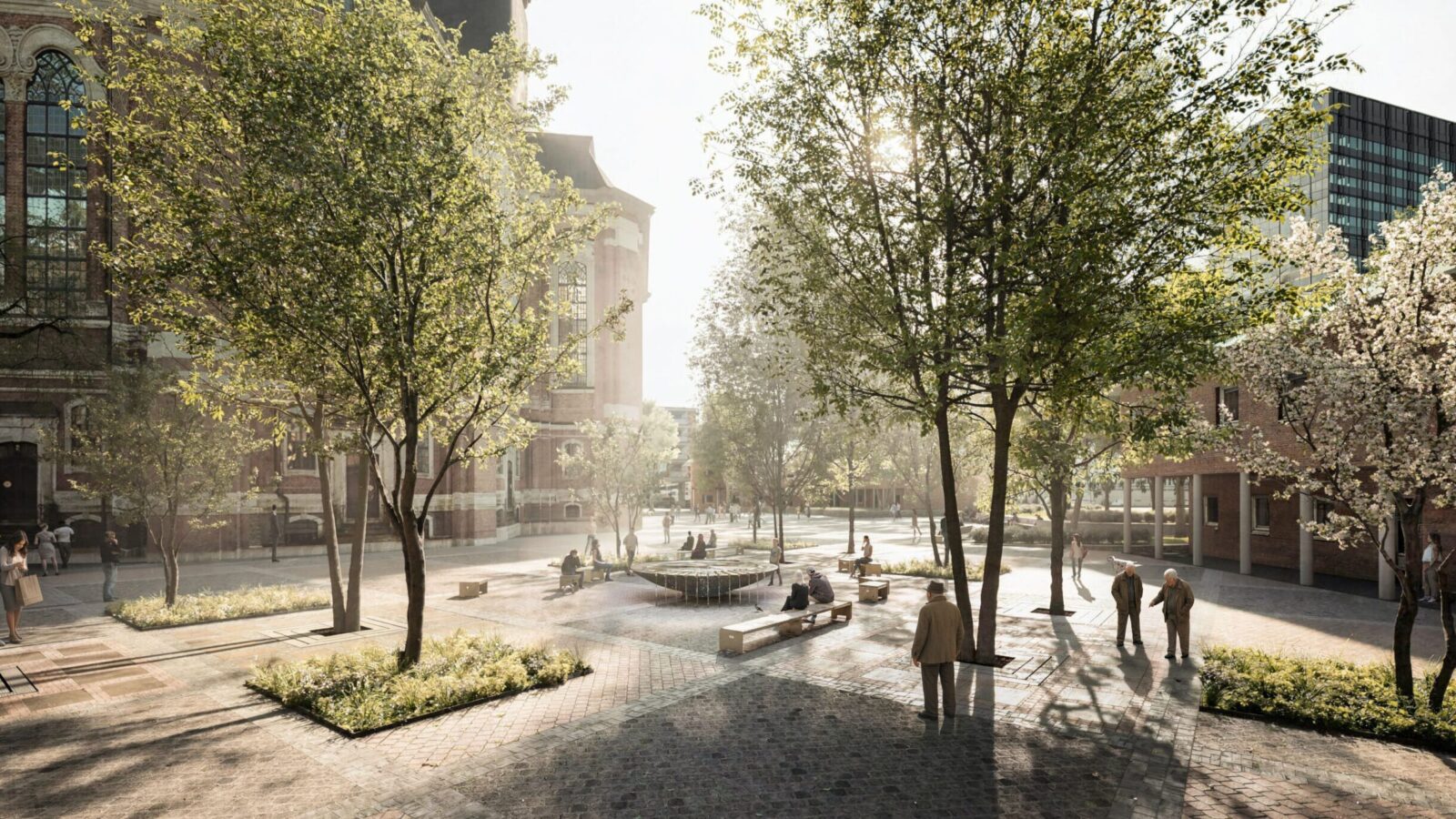 Der Kirchplatz des Michel nach der Umgestaltung. Zu sehen sind Sitzbänke, Bäume und der Brunnen.